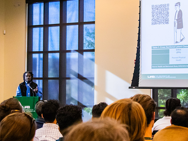 Joshua Lewis presents his research during the lightning talks at the CAS Graduate Research Day.